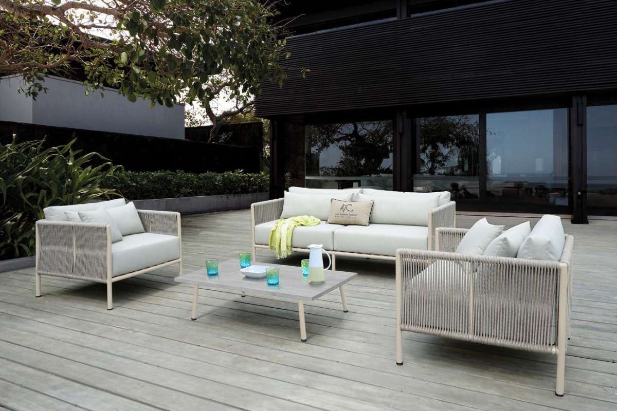 A 4-seater outdoor sofa set arranged in a cozy, refined homestay-style shared area.