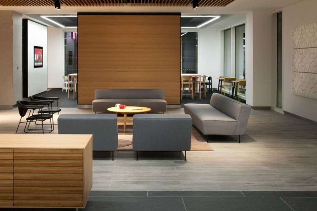 A modern indoor lounge with a 4-seater sofa set arranged as the focal point of the room.