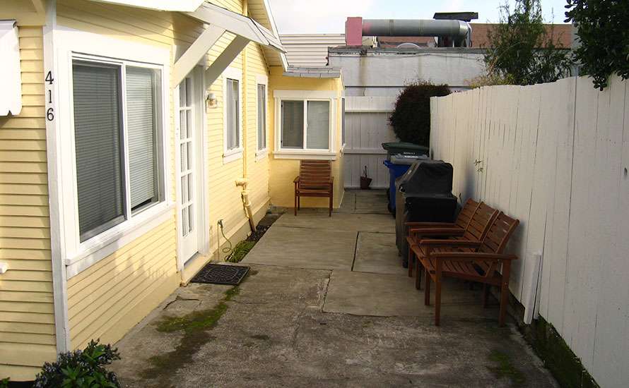 Bare backyard space with awkward arrangement