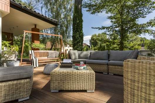 Garden area decorated with cohesive outdoor furniture