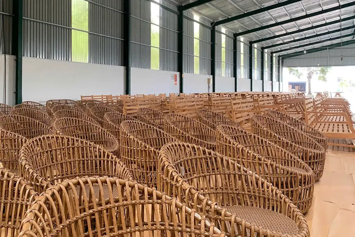 Outdoor furniture factory production showing rattan chairs prepared for quality control.