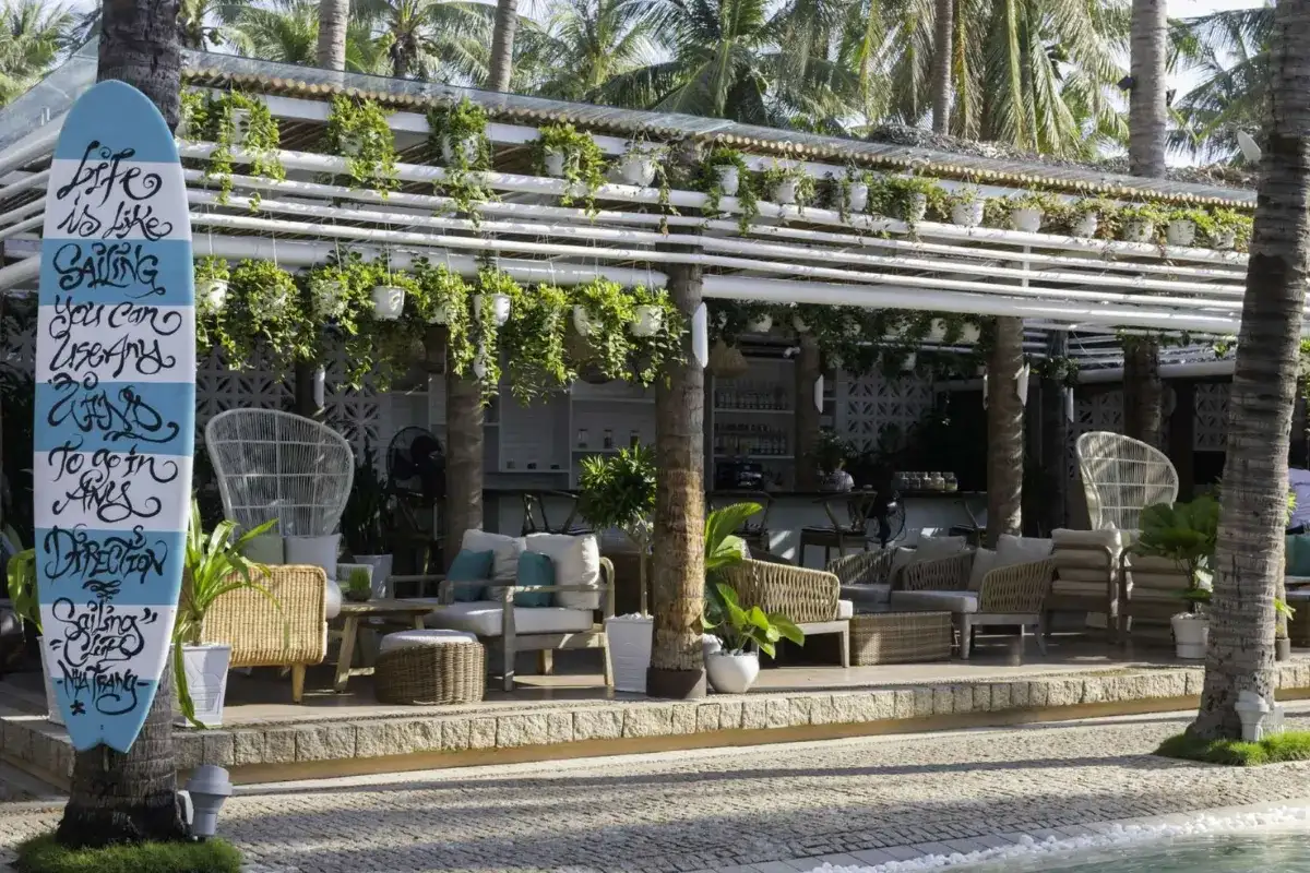 Hotel outdoor lounge furniture arranged for guest relaxation.