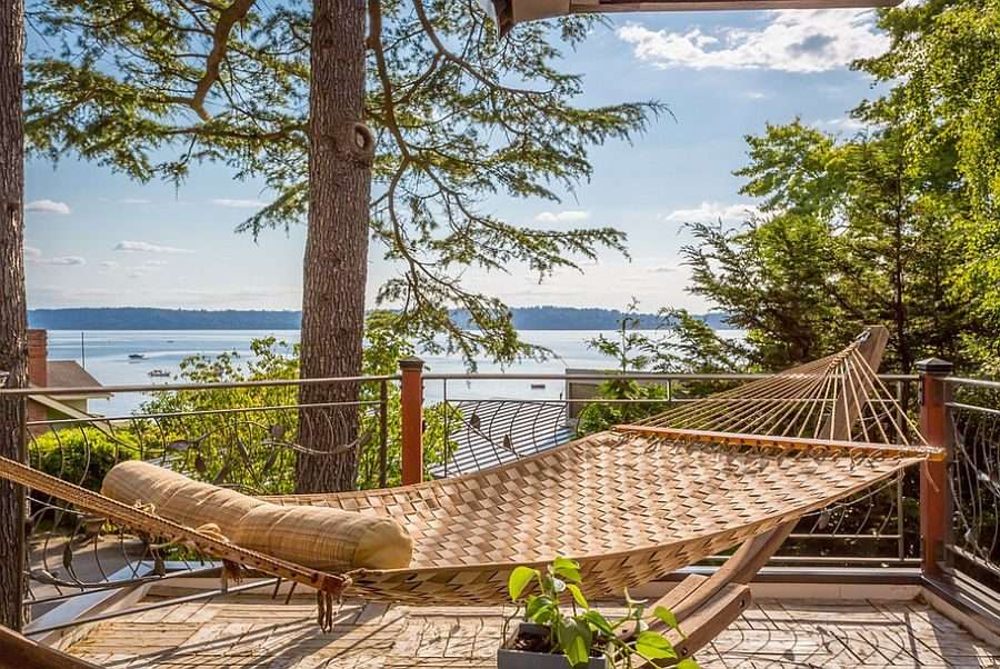 Relaxing outdoor corner featuring a hammock and vibrant greenery