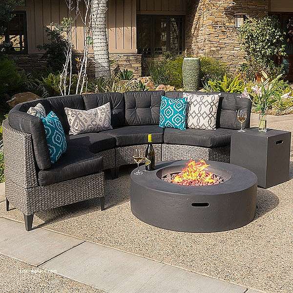 Comfortable cushioned sofa set paired with a cozy fire pit