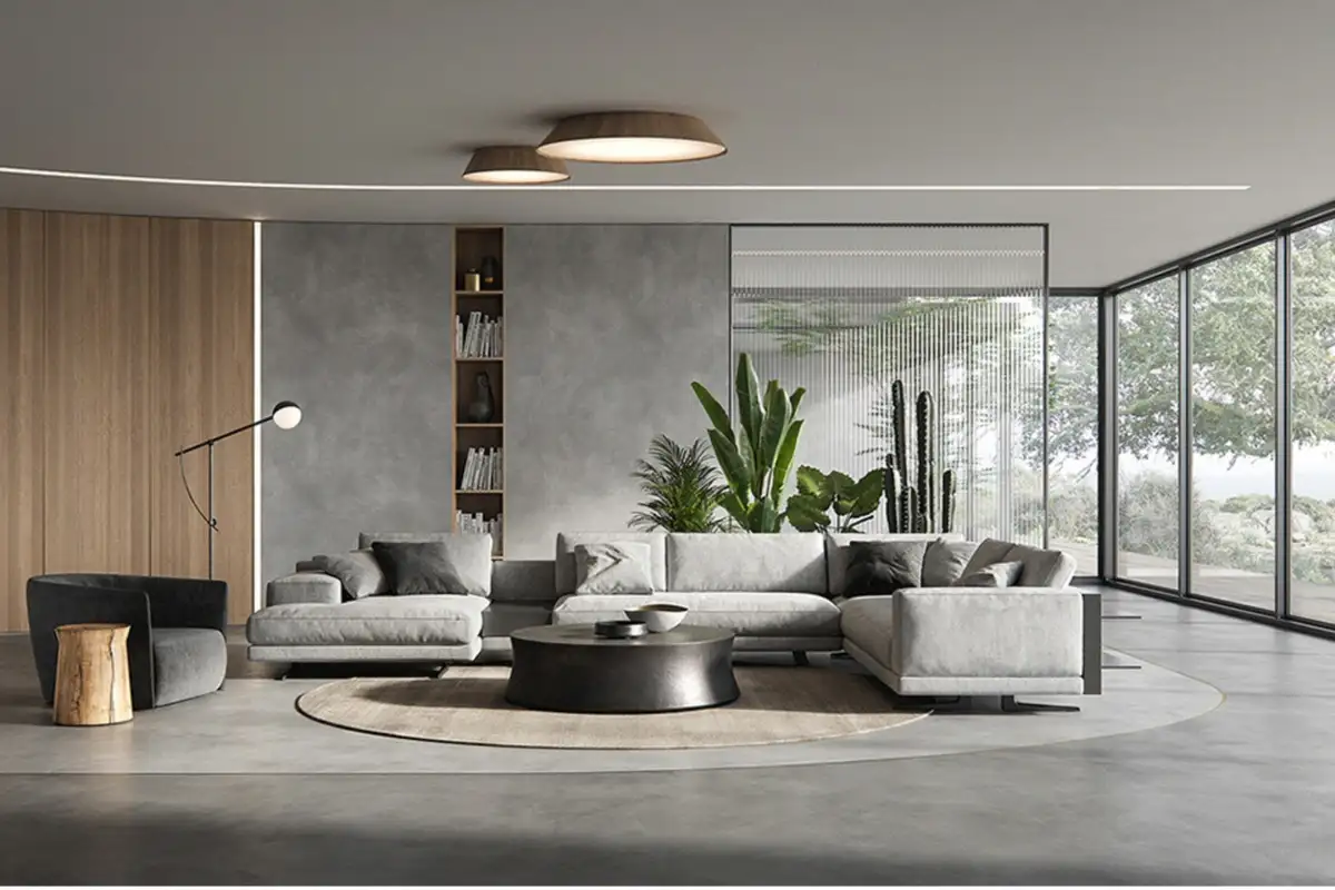 A sleek, minimalist living space featuring a Poliform sectional sofa, neutral tones, modern lighting, and large glass walls bringing in natural light.
