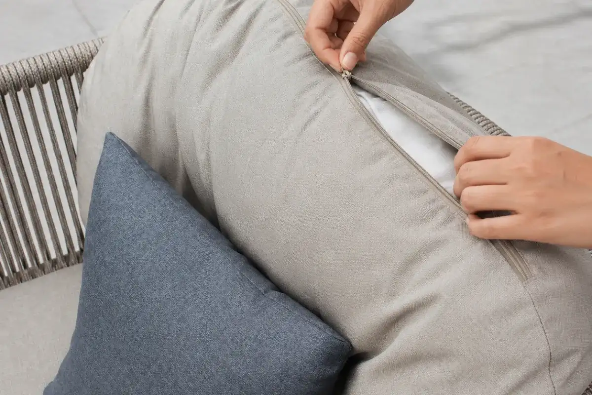 Outdoor furniture cushion with removable cover and weather-resistant fabric