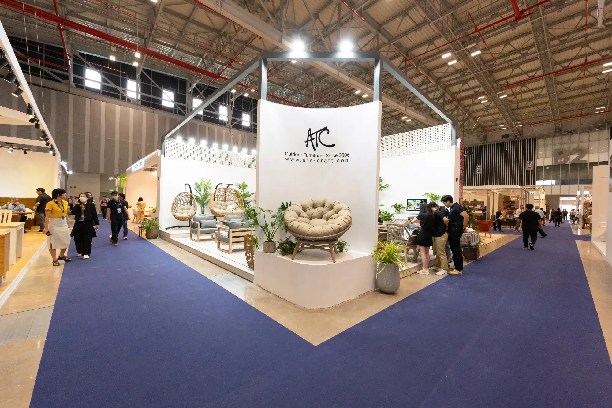 ATC Furniture exhibition booth at a B2B furniture trade fair.