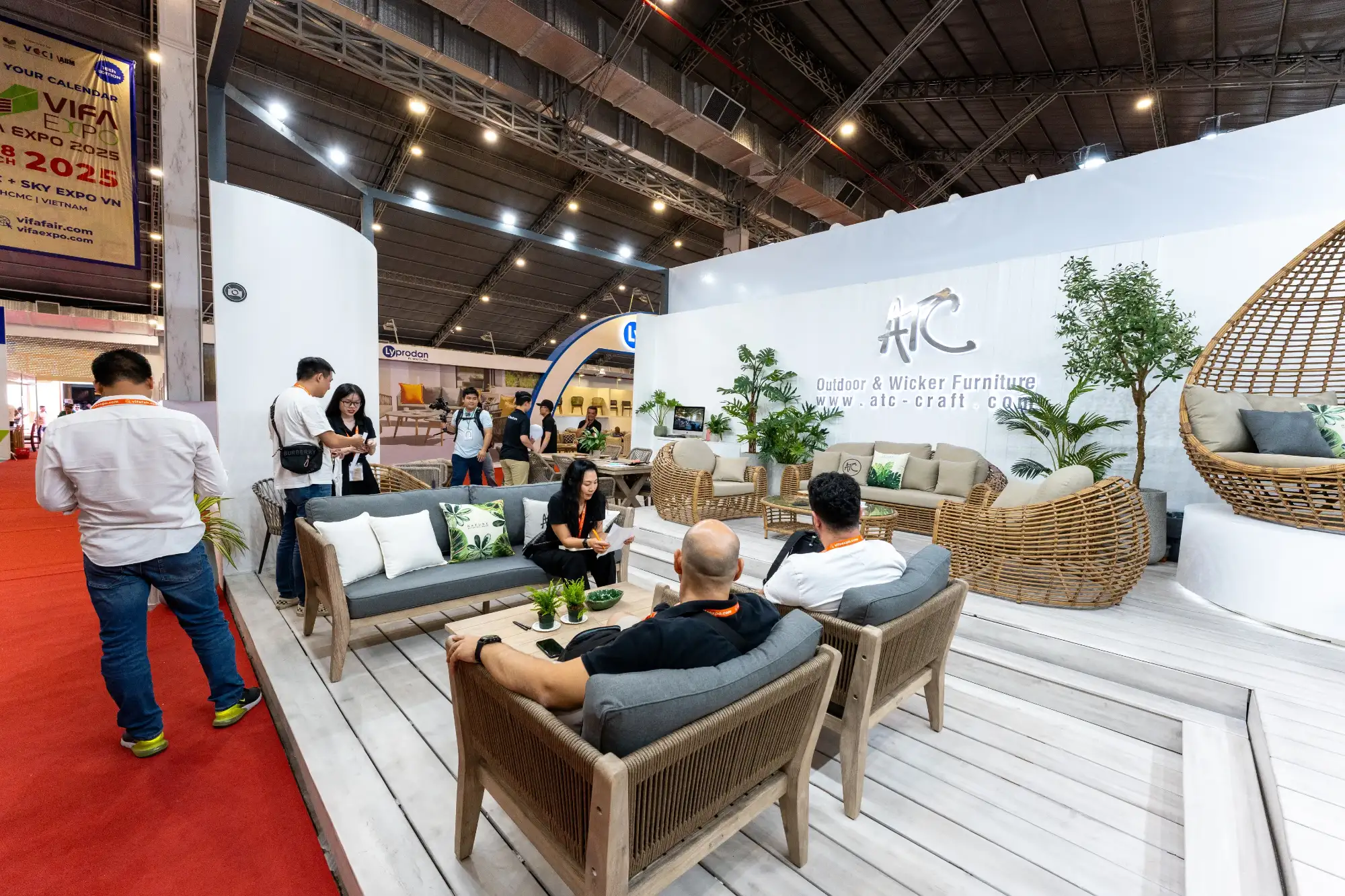 Post-fair discussions at a B2B furniture booth to convert meetings into real cooperation
