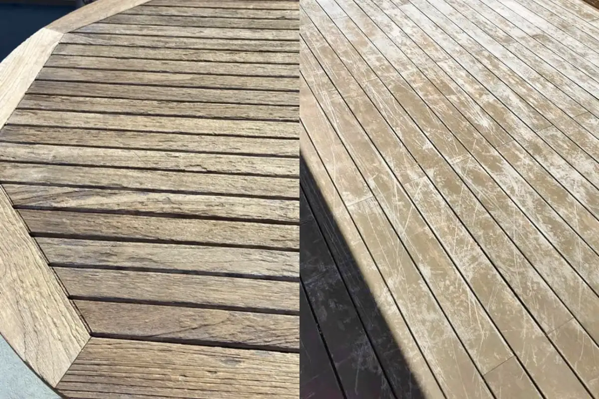 A teak table showing signs of wear with a rough, dull surface.