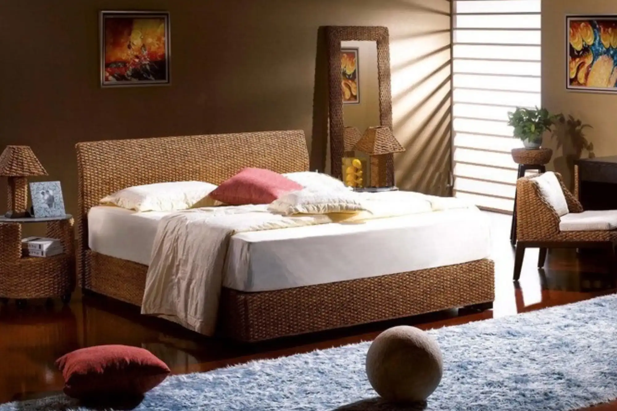 Bedroom interior featuring water hyacinth bed frame, bedside table, and woven furniture, creating a calm and relaxing atmosphere.