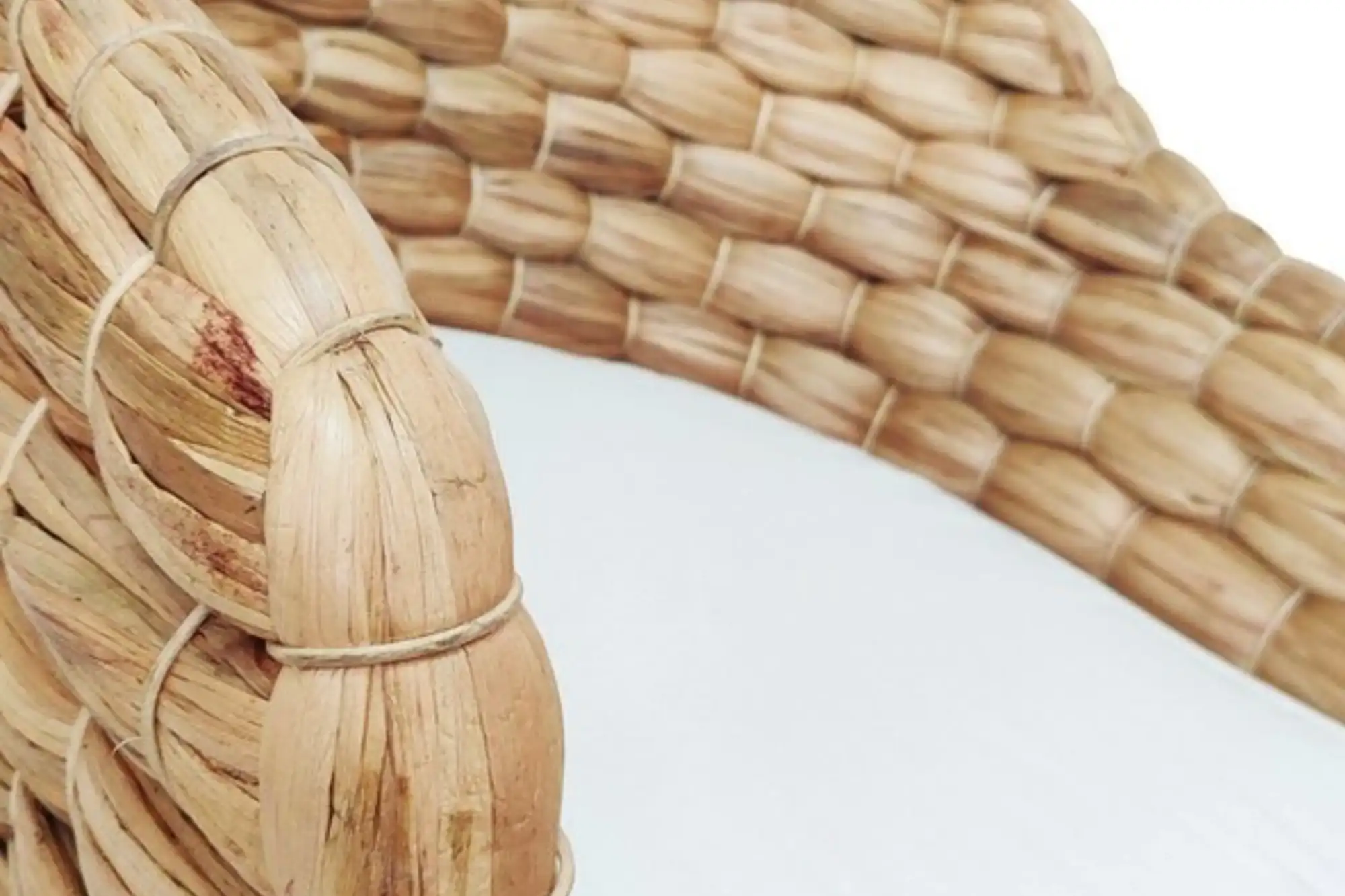 Close up of handwoven water hyacinth fibers, highlighting natural texture and sustainable material structure.