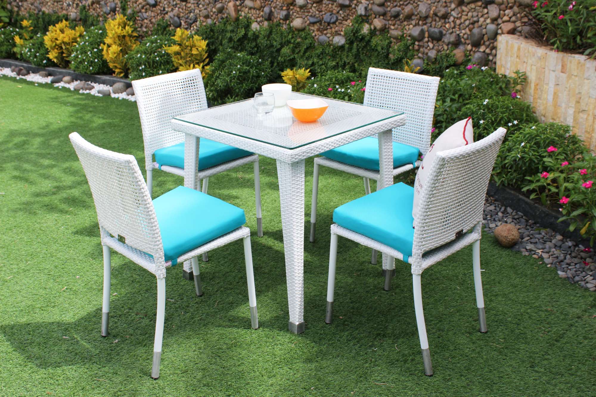 Compact dining table with a modern design, perfect for garden spaces