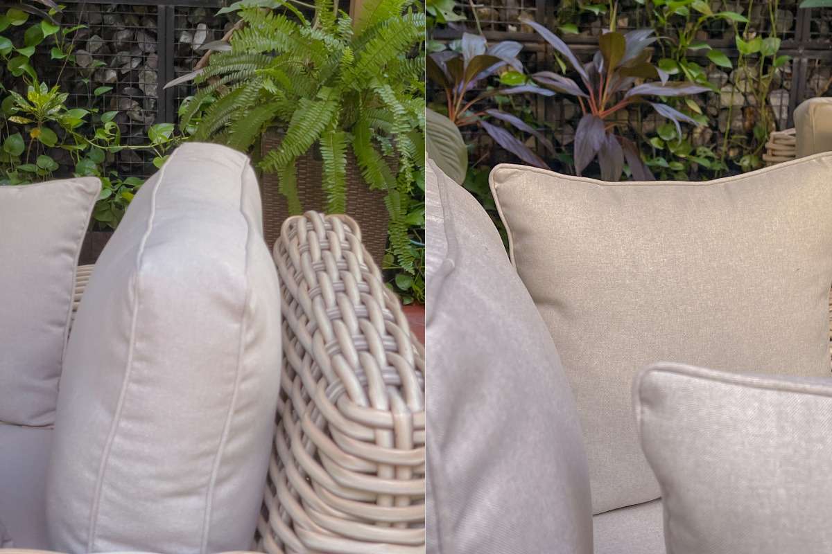 Close-up of outdoor sofa cushions on a rattan frame, highlighting thick UV- and water-resistant fabric suitable for long-term use.
