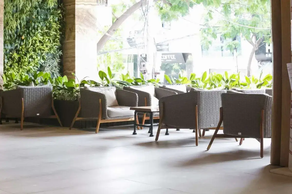 Resort outdoor lobby featuring weather-resistant seating in a welcoming entrance area.