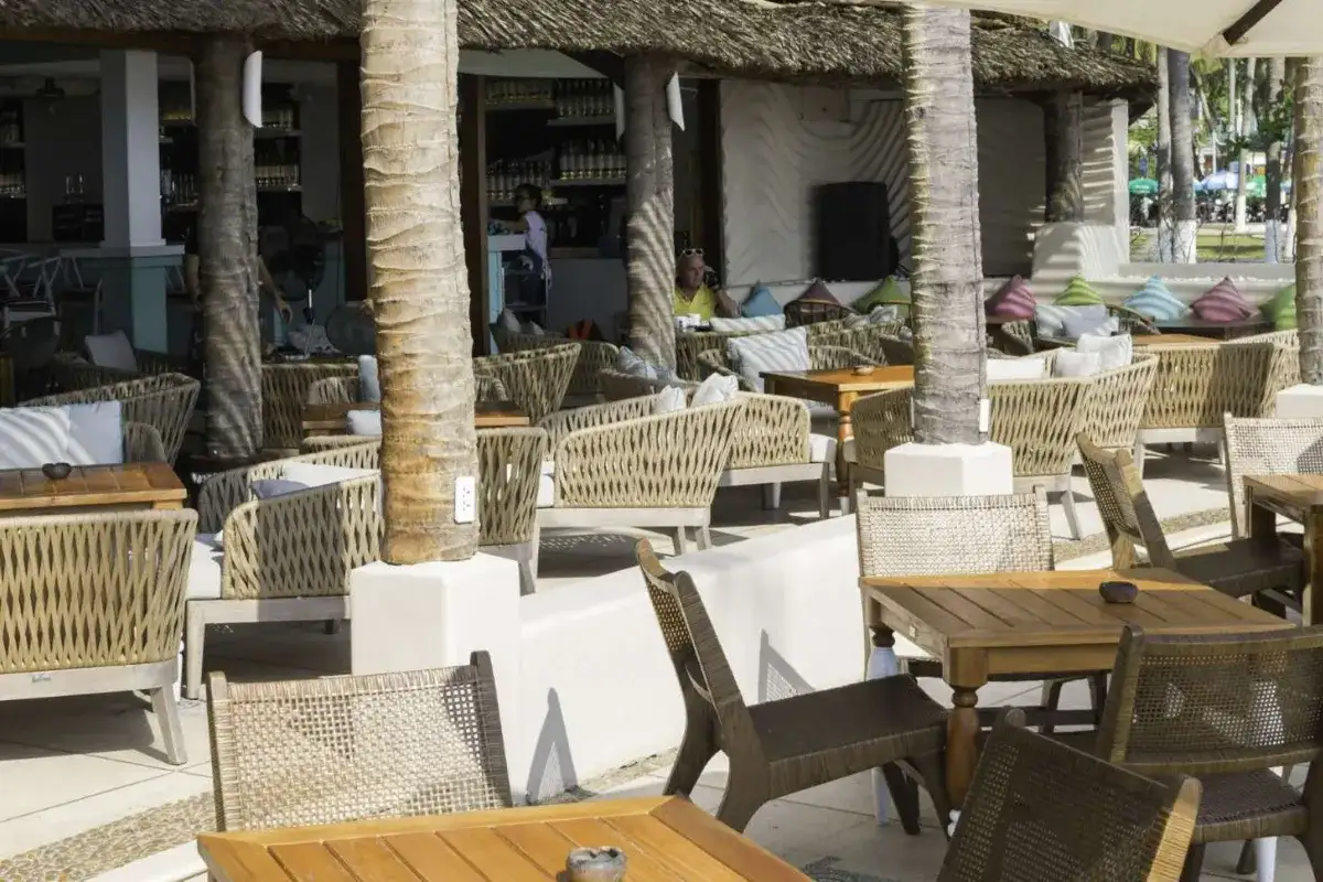 Outdoor patio furniture arranged for social gatherings at a luxury resort.