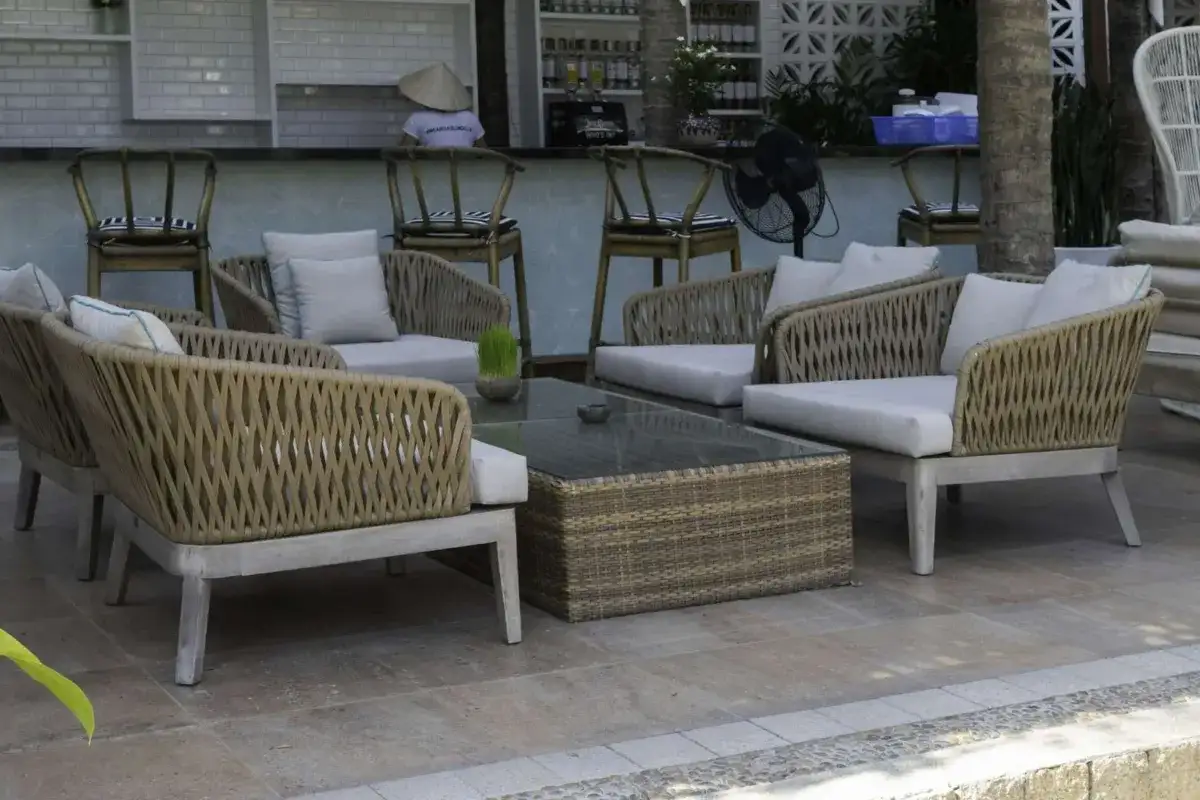Commercial outdoor lounge furniture with modular sofas and a coffee table.