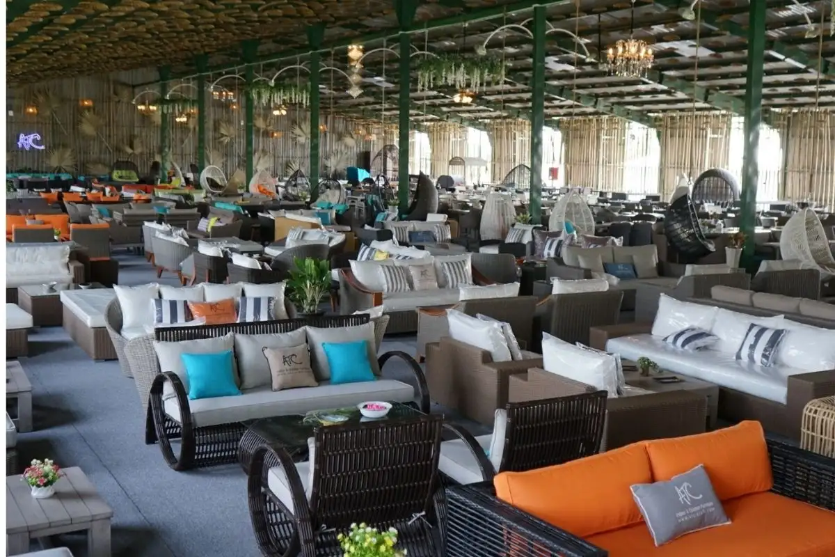 A large ATC Furniture showroom displaying a diverse range of outdoor sofas, chairs, and tables in a vibrant and modern setting.