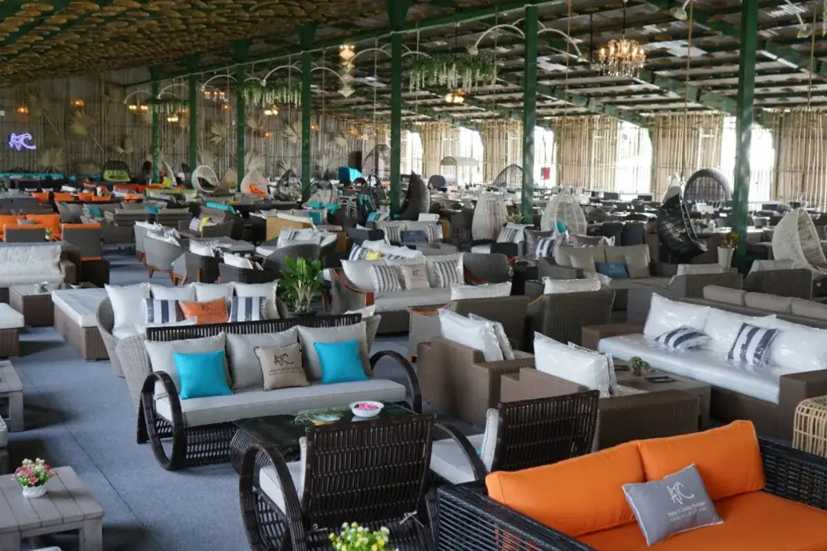 Large outdoor furniture showroom displaying a wide range of sofa collections