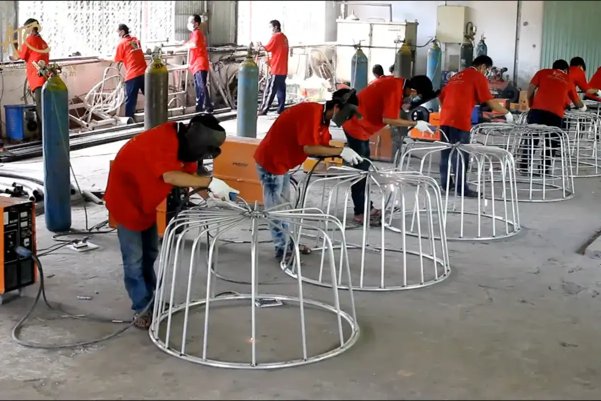 Skilled workers manufacturing outdoor furniture in a Vietnam factory