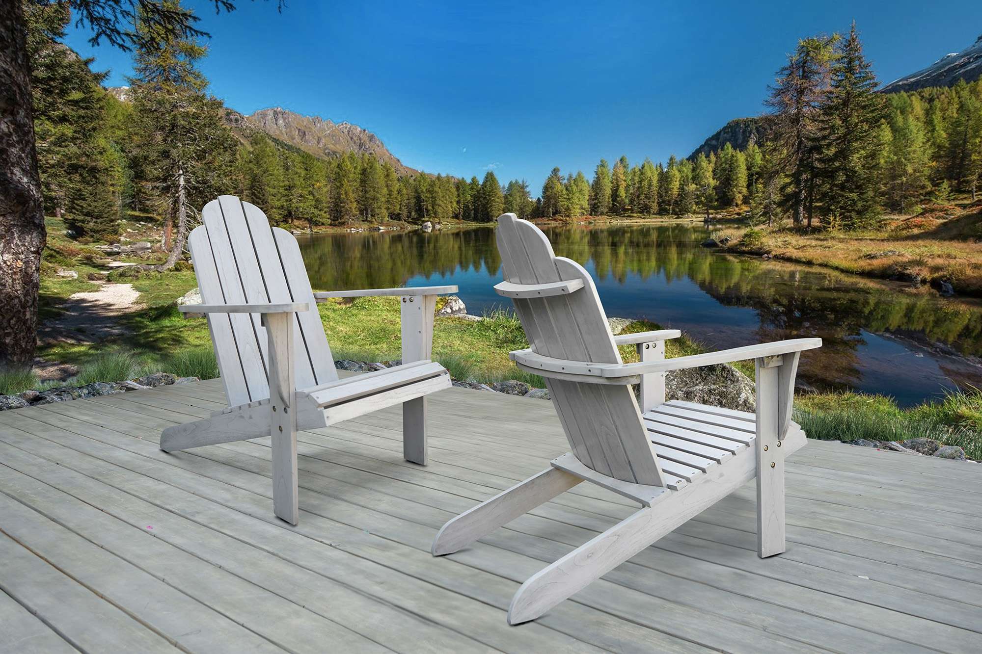 White Adirondack chairs placed near a natural lake.