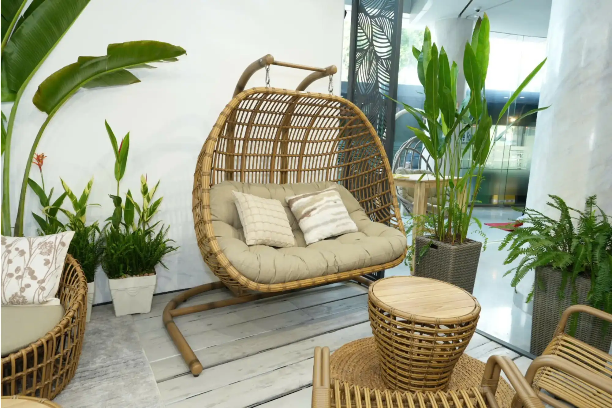 Visual style of a double wicker egg swing chair.