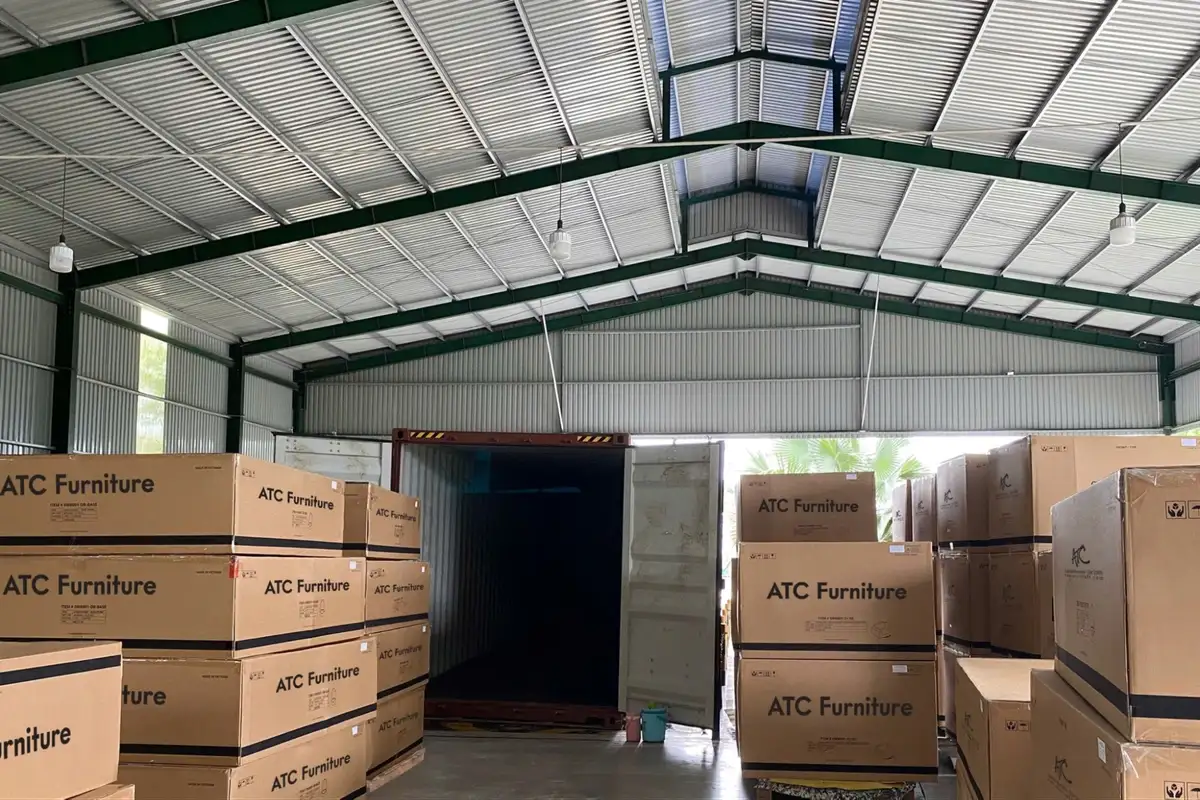 Warehouse with stacked ATC Furniture boxes ready for bulk shipping and container loading
