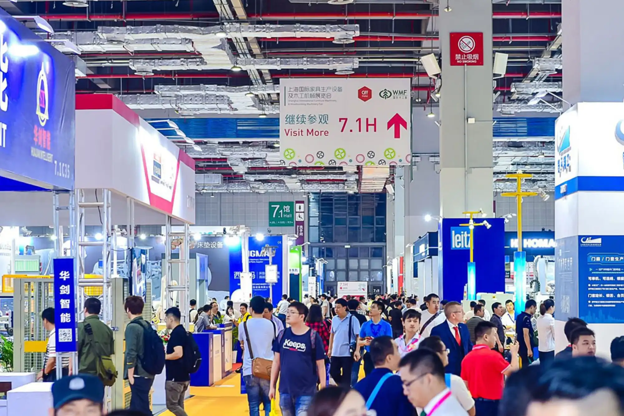 Busy exhibition hall at China Furniture Exhibition with international buyers and export focused booths