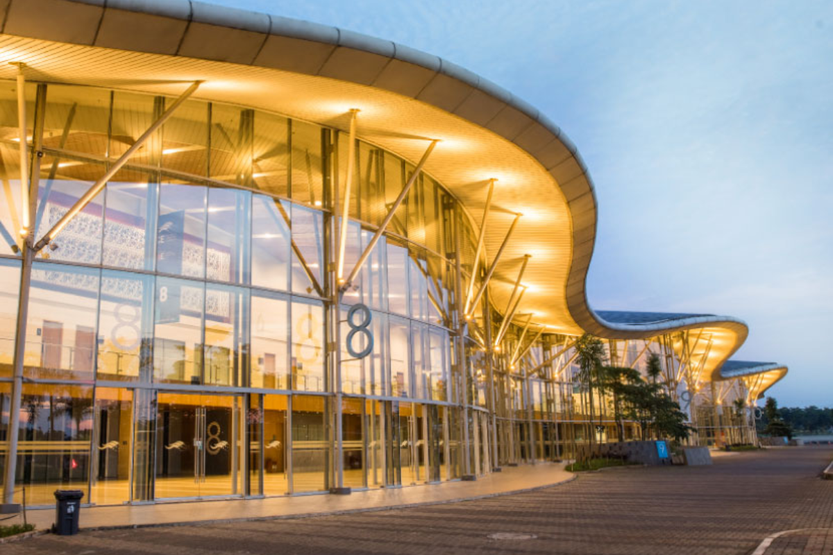 Exterior view of ICE BSD City exhibition center in Tangerang with modern curved glass facade 