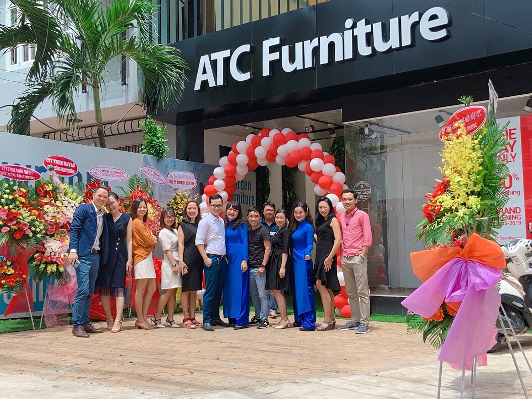 The staff members during in the showroom grand opening day.
