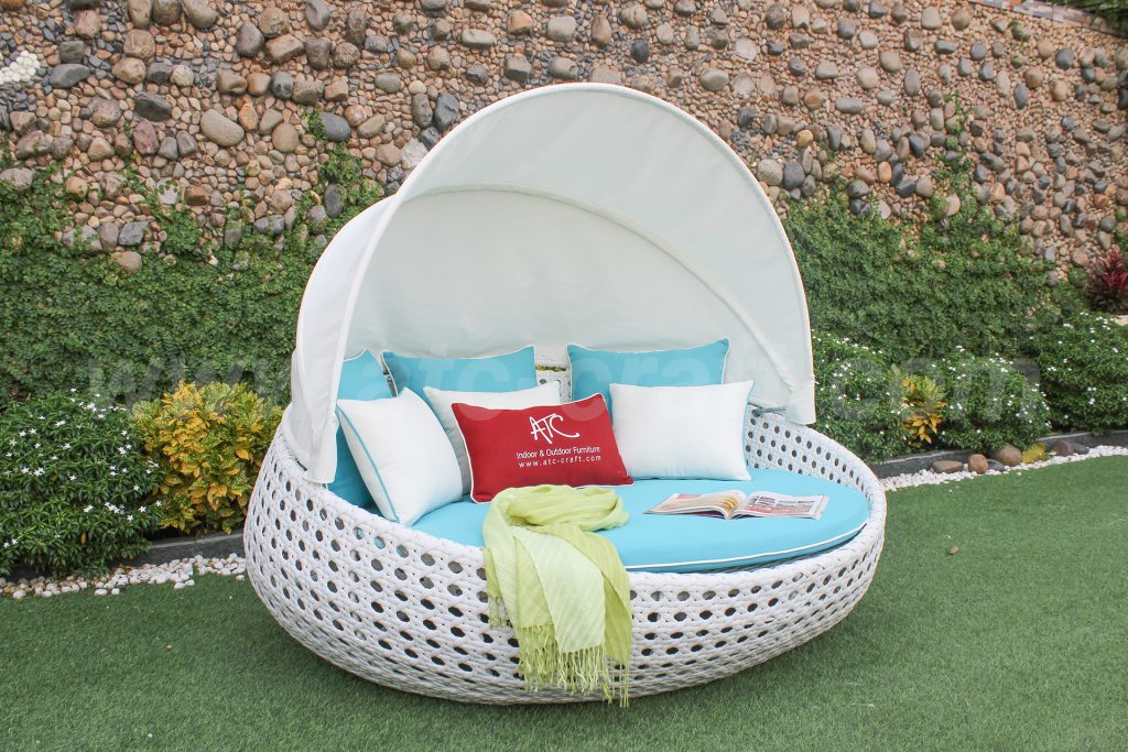 Wicker round sunbed with a canopy