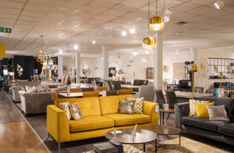 Spacious furniture showroom with sofas and tables for wholesale buyers